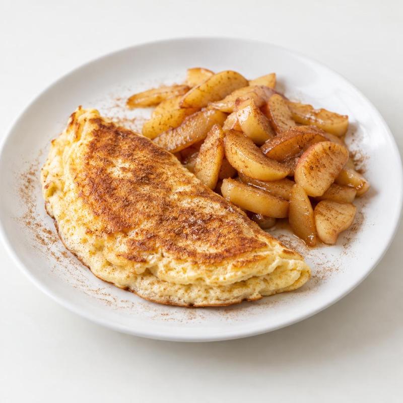 Omlet twarogowy rumieniony na maśle z jabłkami i cynamonem